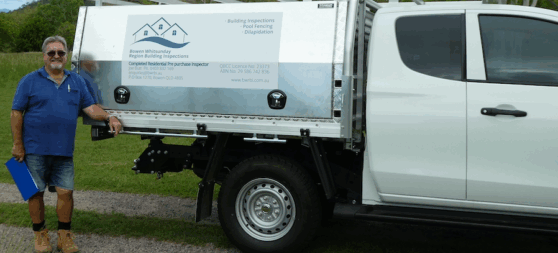 Owner-operator Joe from Bowen Whitsunday Region Building Inspections standing beside company vehicle in Bowen, Queensland.