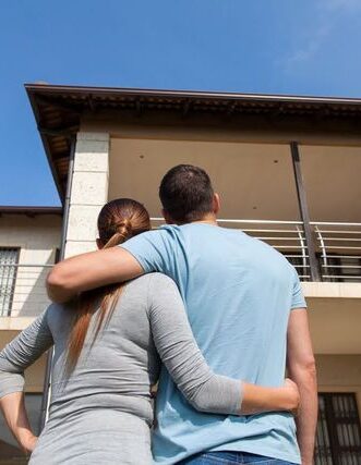 Homebuyers discussing pre-purchase building inspection results in Proserpine, Queensland.